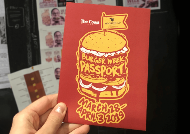 Halifax Burger Week Passport being held up in front of burger week moodboard